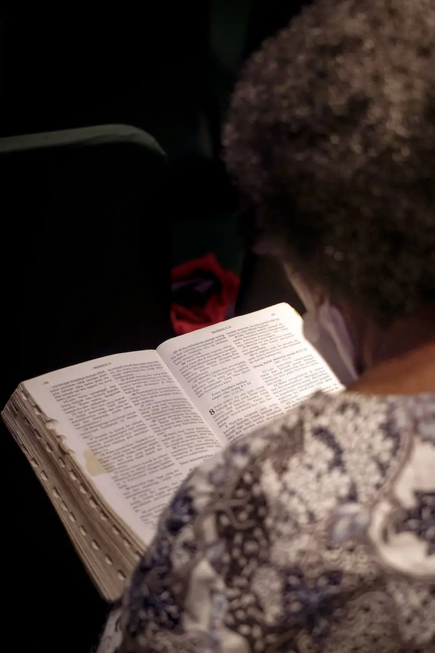 back view of a woman reading the bible